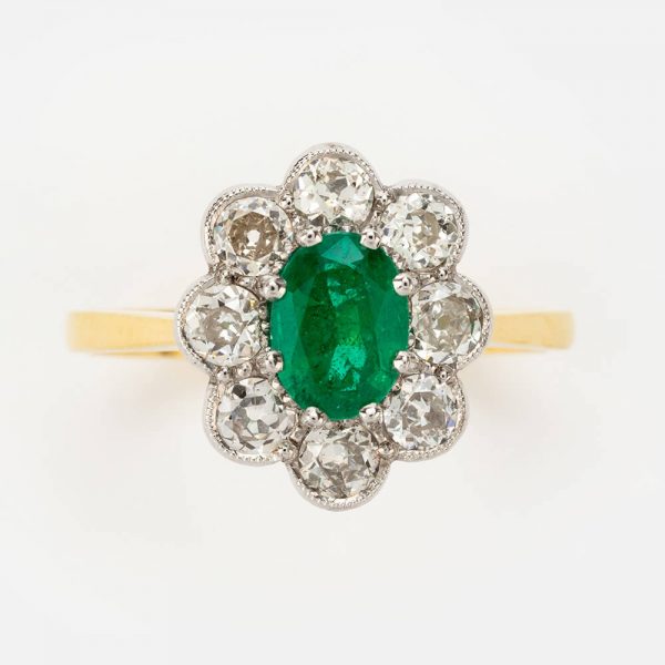 Fine Jewels of Harrogate Modern 0.65 Carat Emerald and 0.64 Carat Diamond cluster Engagement Ring